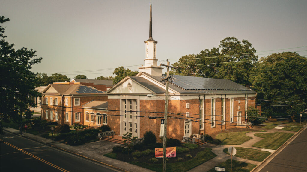 Duncan Memorial United Methodist Church, a brick church with a white steeple, on Henry Street in Ashland